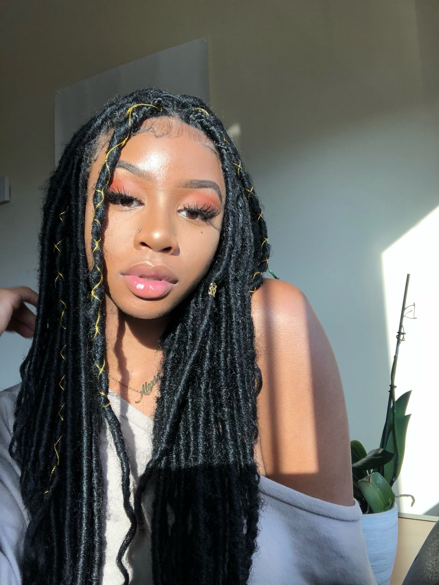 Embracing Versatility: The Integration of Fake Hair in Locs Braided Wigs